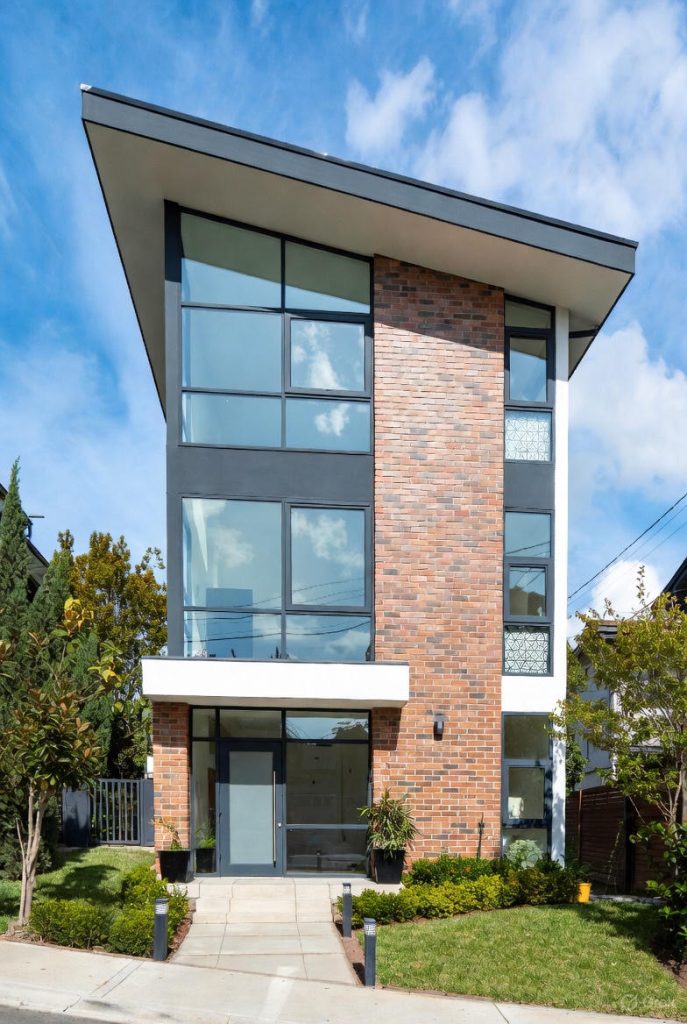 Energy-efficient house elevation designed to reduce artificial cooling and lighting needs